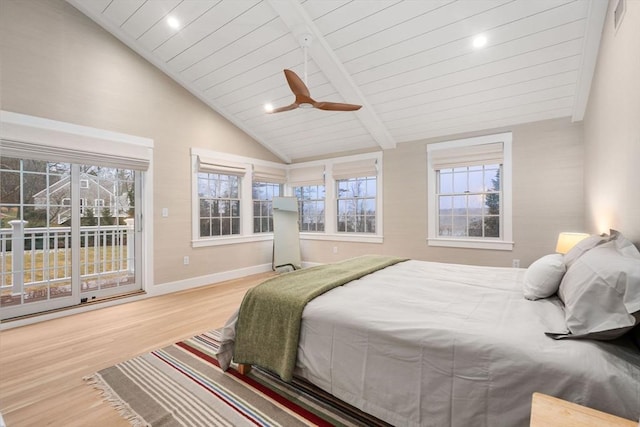 bedroom with multiple windows, wood-type flooring, ceiling fan, and access to outside