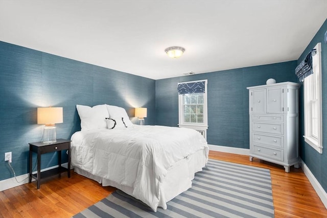 bedroom with wood-type flooring