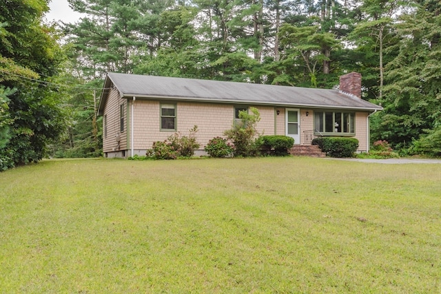 ranch-style home with a front yard