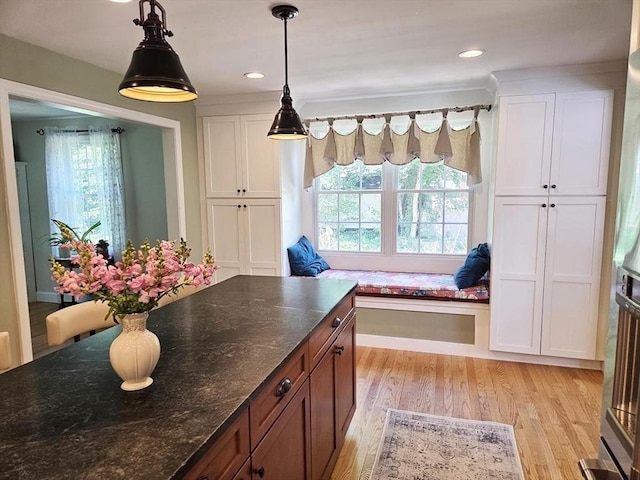 15 Sudbury Rd, Stow, MA 01775 - kitchen with plenty of natural light, light wood-style floors, white cabinetry, decorative light fixtures, and recessed lighting