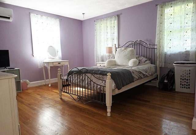 15 Sudbury Rd, Stow, MA 01775 - bedroom with a wall unit AC and wood finished floors