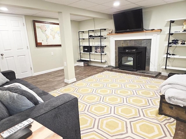 15 Sudbury Rd, Stow, MA 01775 - living area featuring wood finished floors, a drop ceiling, and a wood stove