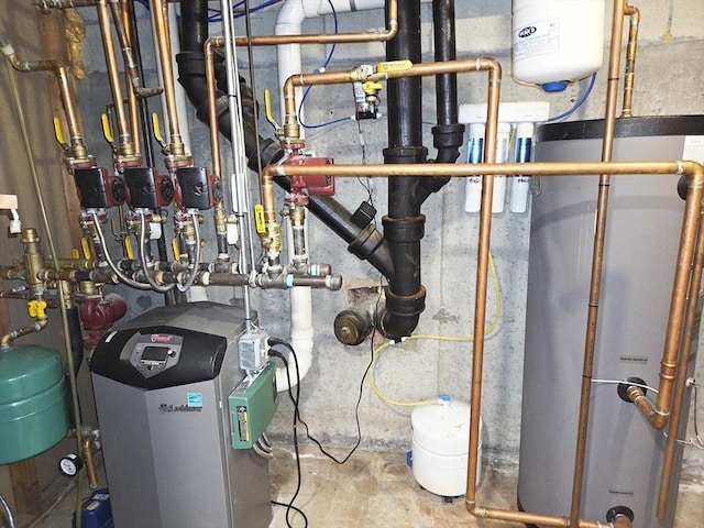 15 Sudbury Rd, Stow, MA 01775 - utility room with water heater and a heating unit