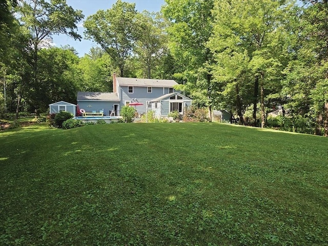 15 Sudbury Rd, Stow, MA 01775 - view of green lawn featuring an outbuilding and an outdoor pool