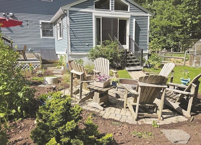 15 Sudbury Rd, Stow, MA 01775 - view of patio / terrace with an outdoor fire pit and entry steps