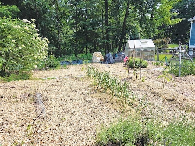 15 Sudbury Rd, Stow, MA 01775 - view of yard featuring a greenhouse and an outbuilding