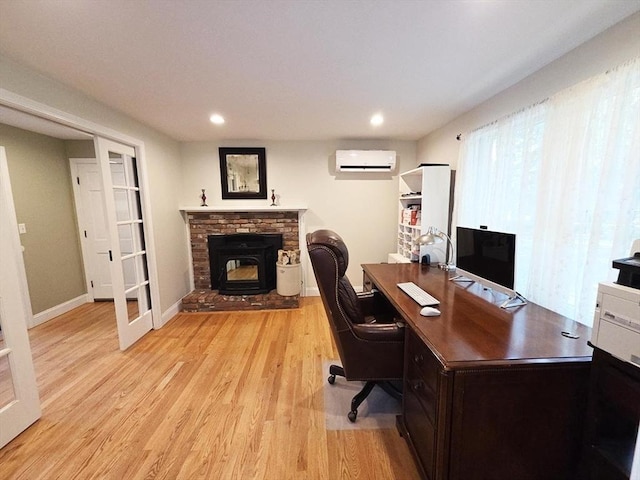 15 Sudbury Rd, Stow, MA 01775 - home office with a wall mounted air conditioner, light wood-style floors, recessed lighting, and a fireplace