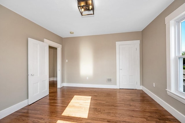 11-13 Read St, Lowell, MA 01850 - empty room with wood finished floors, healthy amount of natural light, and baseboards