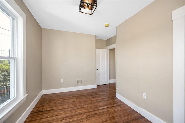11-13 Read St, Lowell, MA 01850 - empty room with dark wood-style flooring and baseboards