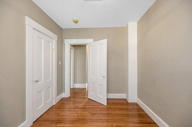 11-13 Read St, Lowell, MA 01850 - unfurnished bedroom with light wood-style flooring and baseboards