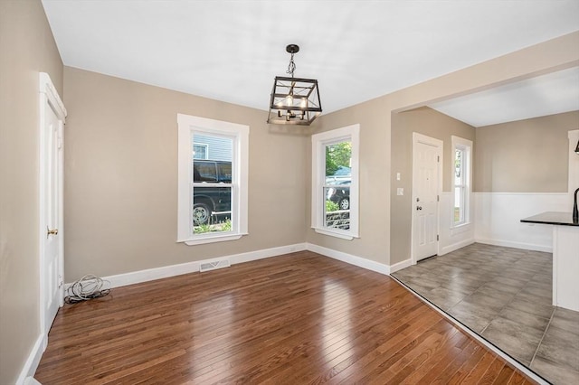 11-13 Read St, Lowell, MA 01850 - entrance foyer with a chandelier, wood-type flooring, and baseboards