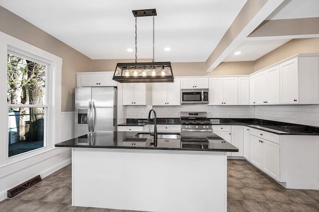 11-13 Read St, Lowell, MA 01850 - kitchen with stainless steel appliances, a sink, decorative backsplash, white cabinets, and recessed lighting
