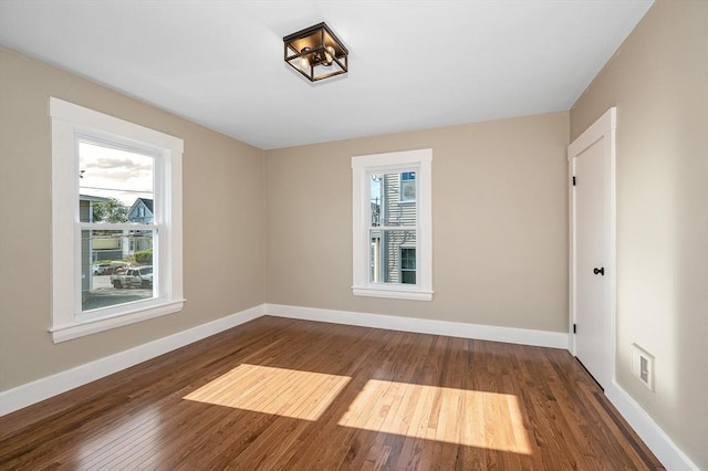 11-13 Read St, Lowell, MA 01850 - unfurnished room with wood finished floors and baseboards