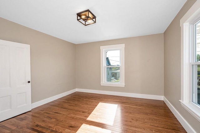 11-13 Read St, Lowell, MA 01850 - spare room featuring plenty of natural light, wood finished floors, and baseboards