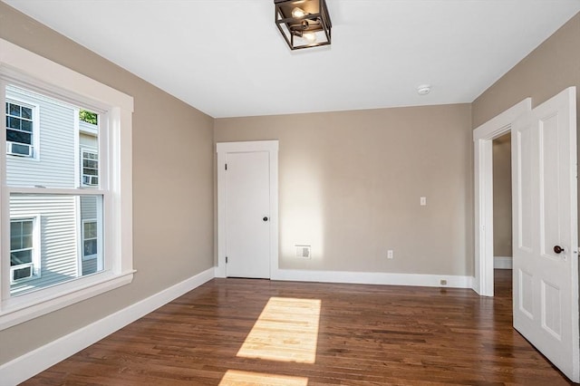 11-13 Read St, Lowell, MA 01850 - spare room with dark wood-type flooring, baseboards, and a smoke detector