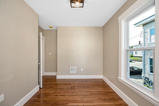 11-13 Read St, Lowell, MA 01850 - spare room with wood finished floors and baseboards