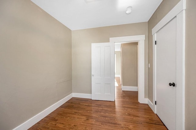 11-13 Read St, Lowell, MA 01850 - unfurnished bedroom with baseboards, wood finished floors, and a closet