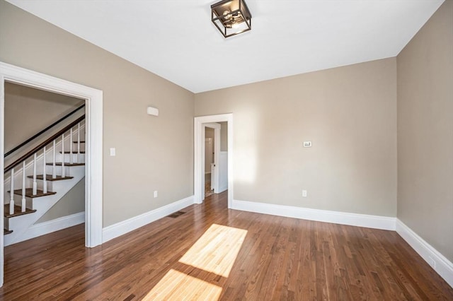11-13 Read St, Lowell, MA 01850 - unfurnished room featuring stairway, baseboards, and wood finished floors