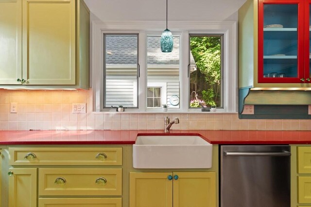 1395 Canton Ave, Milton, MA 02186 - kitchen with dishwasher, green cabinetry, and tasteful backsplash