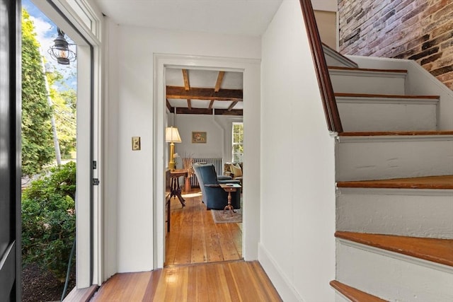 1395 Canton Ave, Milton, MA 02186 - interior space with hardwood / wood-style floors, beamed ceiling, and brick wall