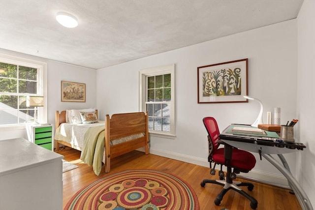 1395 Canton Ave, Milton, MA 02186 - bedroom with light wood-type flooring and an office area