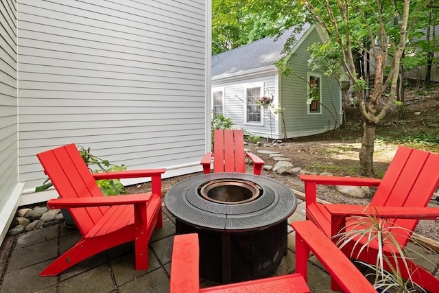 1395 Canton Ave, Milton, MA 02186 - view of patio featuring a fire pit