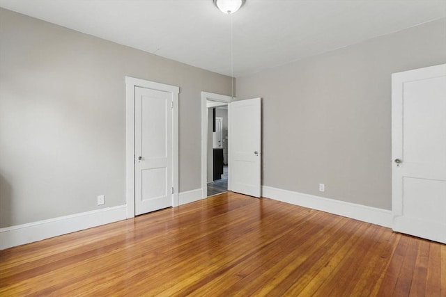 31-33 Beauchamp St, Springfield, MA 01107 - unfurnished bedroom featuring hardwood / wood-style floors and baseboards