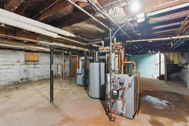 31-33 Beauchamp St, Springfield, MA 01107 - unfinished below grade area with water heater and a heating unit