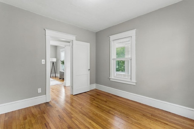 31-33 Beauchamp St, Springfield, MA 01107 - empty room featuring healthy amount of natural light, light wood-type flooring, and baseboards