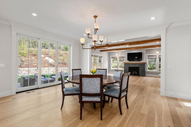 dining space featuring recessed lighting, baseboards, a chandelier, and light wood-style flooring