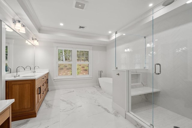 bathroom featuring double vanity, a shower stall, a sink, and visible vents
