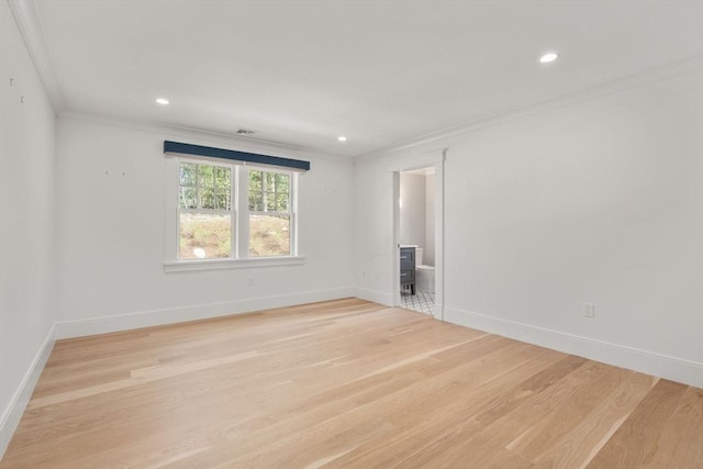 unfurnished room featuring recessed lighting, baseboards, ornamental molding, and light wood finished floors