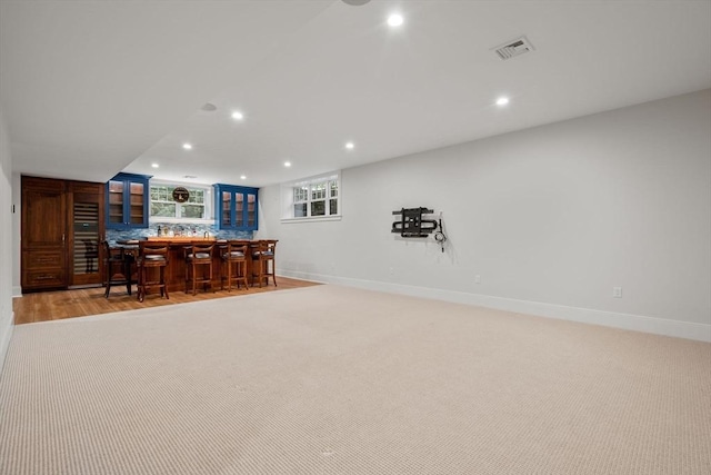 bar with indoor wet bar, recessed lighting, baseboards, and visible vents
