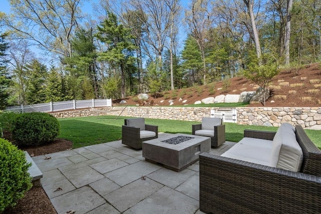 view of patio featuring fence and an outdoor fire pit