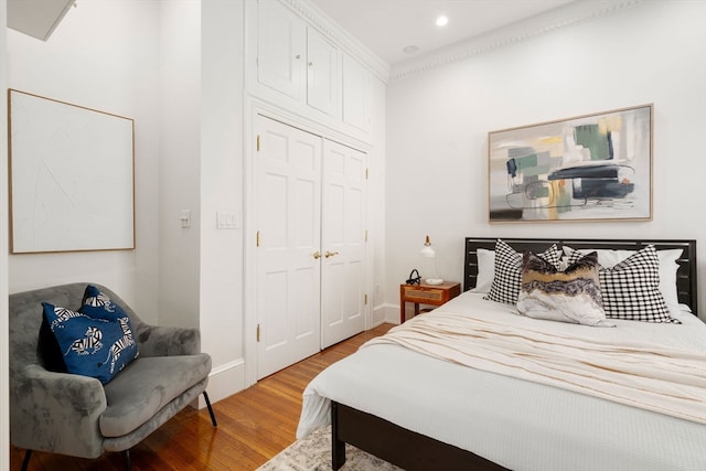 bedroom with a closet and light wood-type flooring