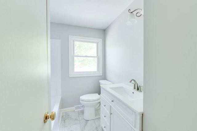 24 Harwich Rd, East Longmeadow, MA 01028 - bathroom featuring marble look tiles, vanity, toilet, and baseboards