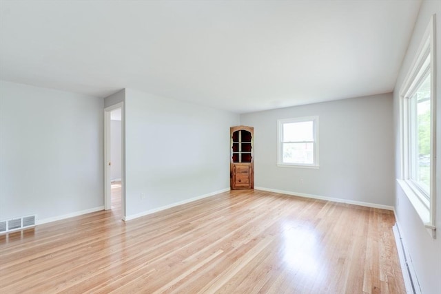 24 Harwich Rd, East Longmeadow, MA 01028 - empty room with a baseboard radiator, light wood-style flooring, and baseboards
