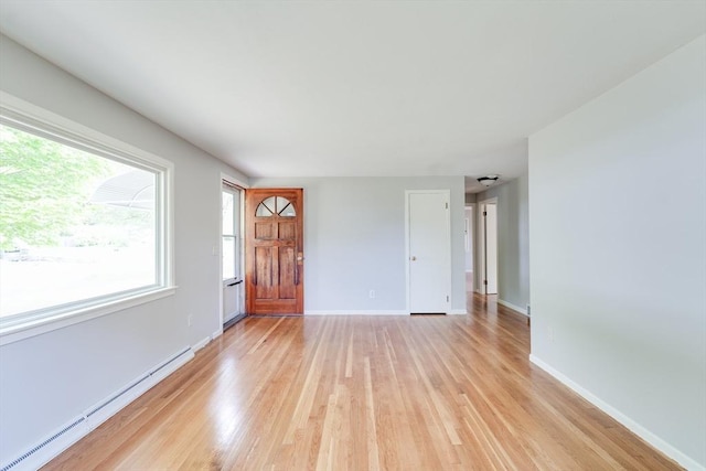 24 Harwich Rd, East Longmeadow, MA 01028 - spare room featuring a baseboard heating unit, light wood finished floors, and baseboards