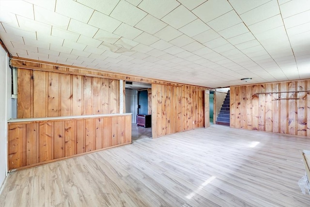 24 Harwich Rd, East Longmeadow, MA 01028 - spare room with wood finished floors, stairway, and wood walls