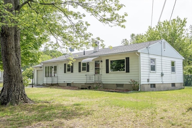 24 Harwich Rd, East Longmeadow, MA 01028 - back of property featuring a yard, a garage, and a chimney
