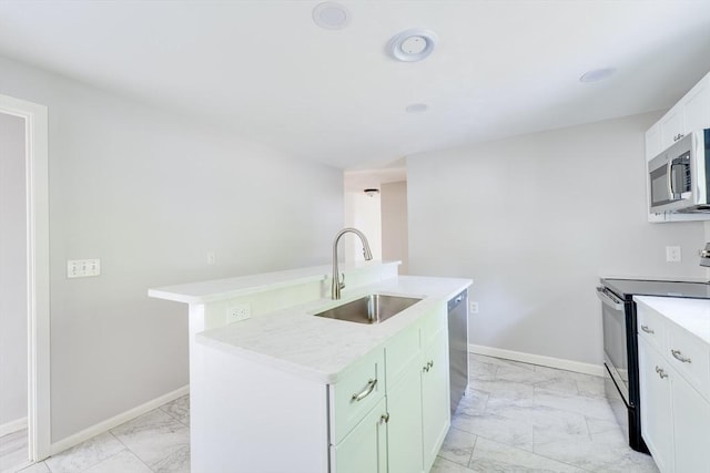 24 Harwich Rd, East Longmeadow, MA 01028 - kitchen featuring stainless steel appliances, light marble finish flooring, a sink, and light countertops