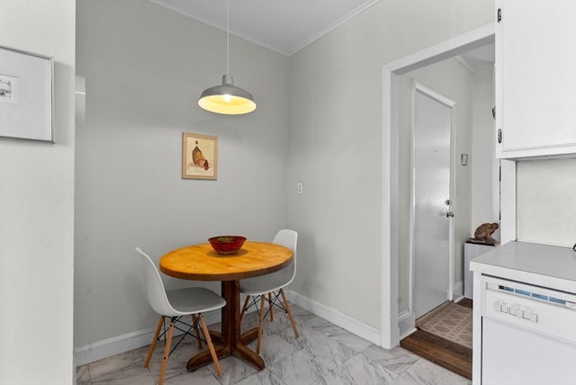 dining area featuring ornamental molding, light marble finish flooring, and baseboards