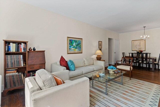 living area featuring wood finished floors and a chandelier