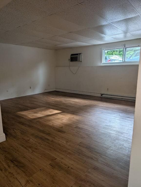 300 Smithfield Rd Unit 2-2, North Providence, RI 02904 - empty room with hardwood / wood-style floors, a wall mounted AC, a baseboard radiator, and baseboards