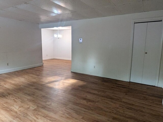 300 Smithfield Rd Unit 2-2, North Providence, RI 02904 - spare room featuring wood finished floors, baseboards, and a chandelier