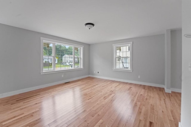 21 Stephanie St Unit 1, Gardner, MA 01440 - spare room featuring healthy amount of natural light, light wood-type flooring, and baseboards