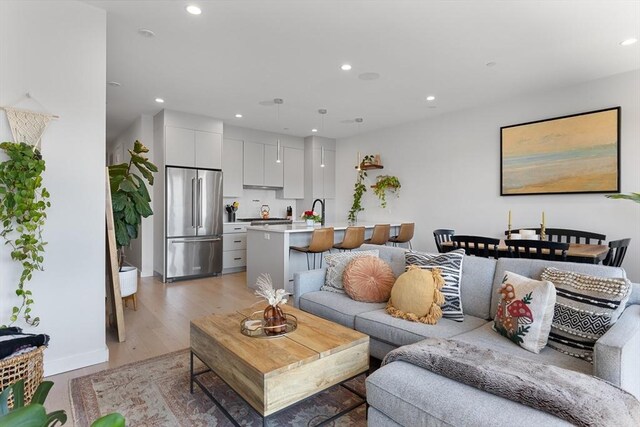 340 W 2nd St Unit 23, Boston, MA 02127 - living area with recessed lighting, light wood-type flooring, and baseboards