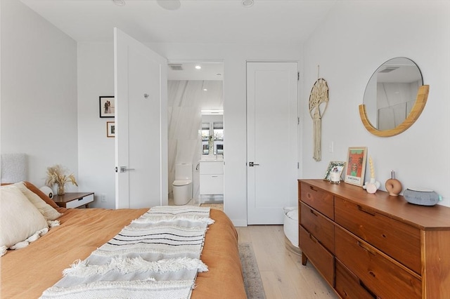 340 W 2nd St Unit 23, Boston, MA 02127 - bedroom with light wood-type flooring, recessed lighting, and ensuite bathroom