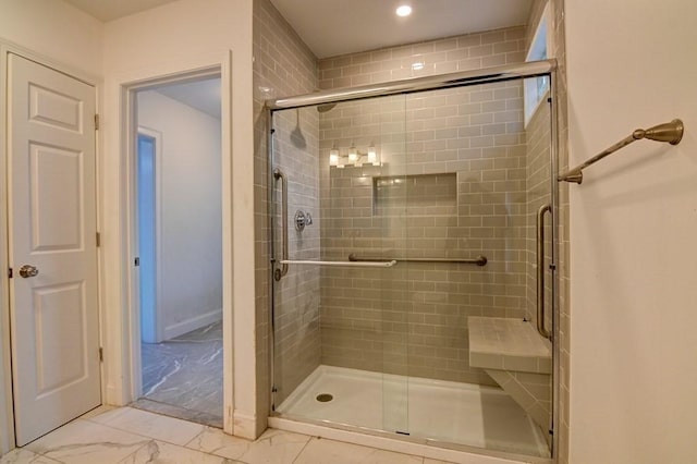bathroom featuring a stall shower, recessed lighting, and marble finish floor