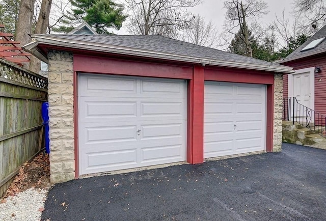 detached garage with fence